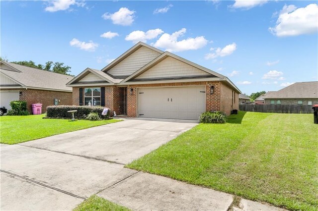 view of front of property featuring a garage and a front lawn