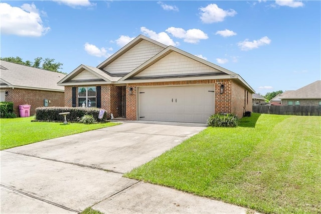 view of front of home featuring a garage and a front yard