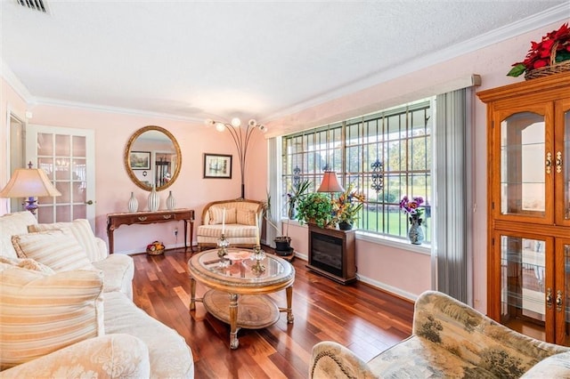 living room with crown molding and hardwood / wood-style floors