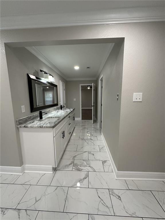 bathroom with vanity and ornamental molding