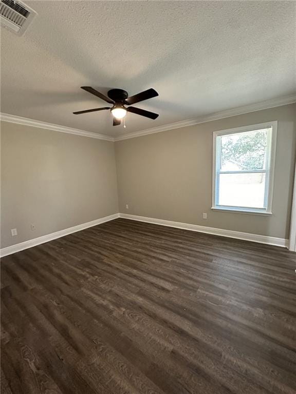 spare room with a textured ceiling, ceiling fan, crown molding, and dark hardwood / wood-style floors