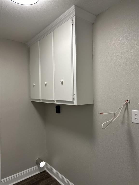 washroom featuring cabinets