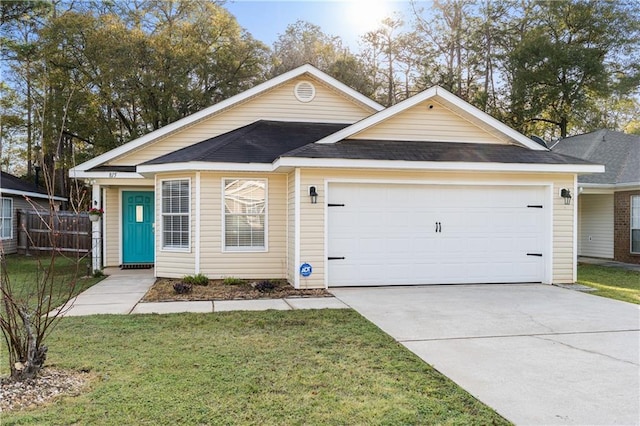 single story home with a shingled roof, fence, concrete driveway, a front yard, and an attached garage