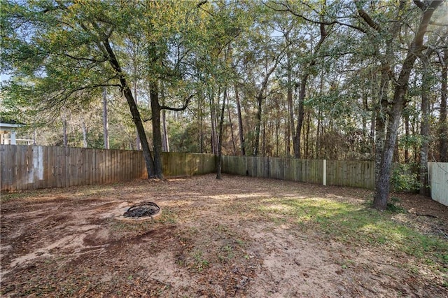 view of yard with a fenced backyard