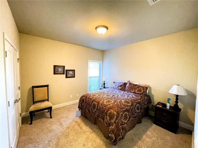 bedroom featuring light carpet