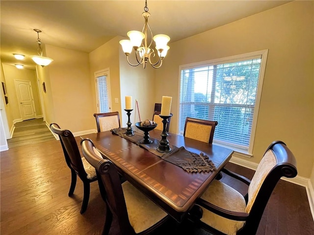 dining area with a chandelier and hardwood / wood-style flooring