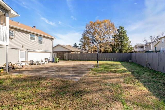 view of yard featuring a patio area and a garage