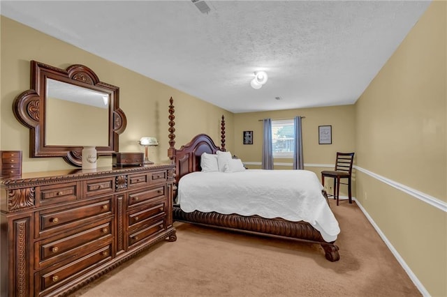 carpeted bedroom with a textured ceiling