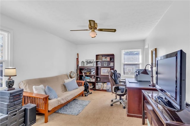 office area featuring ceiling fan, light carpet, and a wealth of natural light