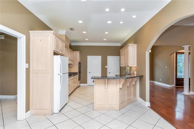 unfurnished room with ceiling fan, dark hardwood / wood-style flooring, and ornamental molding