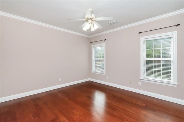 unfurnished bedroom featuring ceiling fan, dark hardwood / wood-style floors, and crown molding