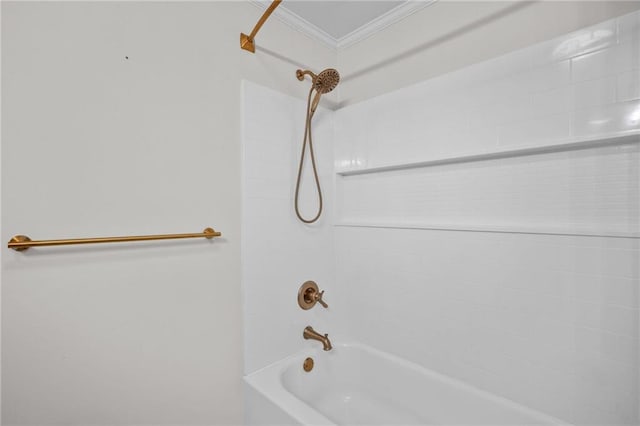 full bath with crown molding and washtub / shower combination