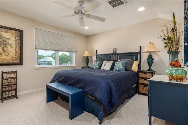 bedroom with ceiling fan, light carpet, and vaulted ceiling