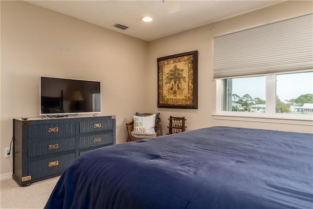 carpeted bedroom with ceiling fan