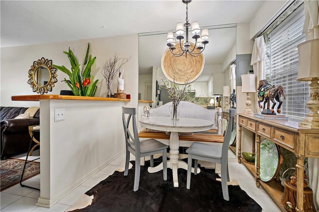 tiled dining space with a notable chandelier