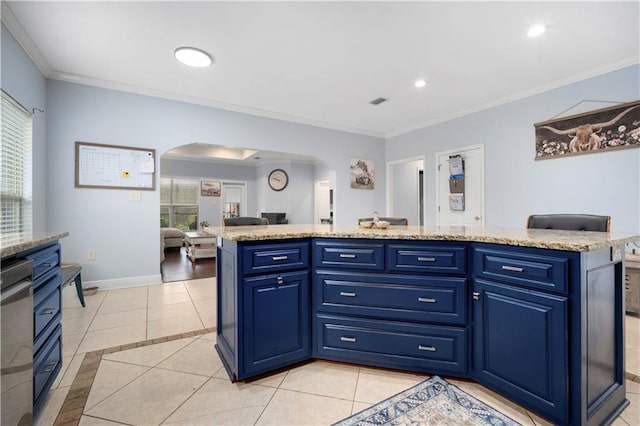 kitchen featuring baseboards, arched walkways, a wealth of natural light, and ornamental molding