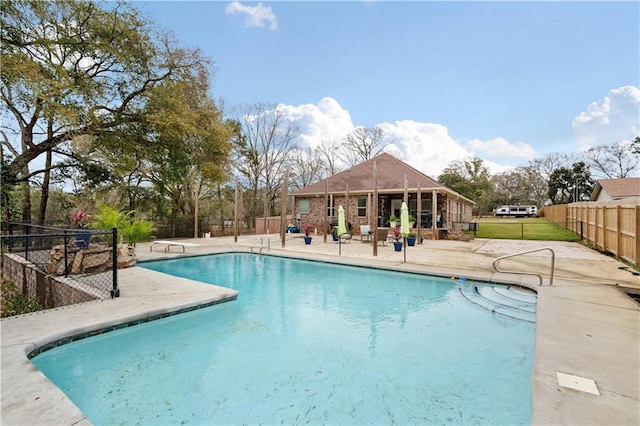 view of pool featuring a fenced in pool, a diving board, a patio, and fence