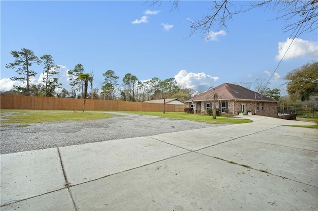 exterior space with concrete driveway