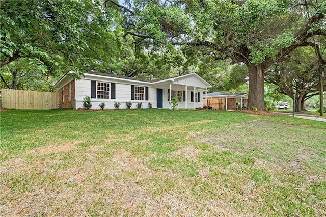 ranch-style house with fence and a front yard