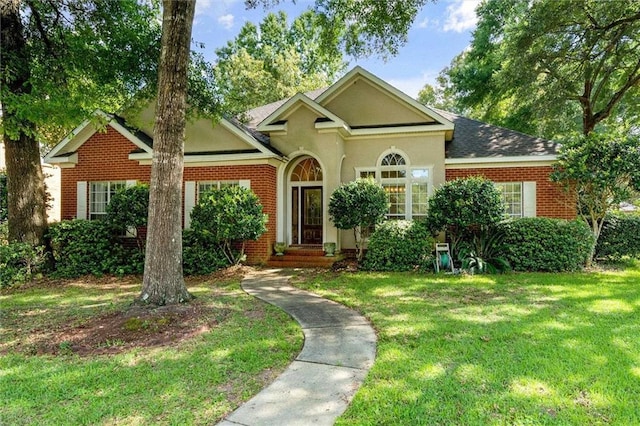 ranch-style house with a front lawn