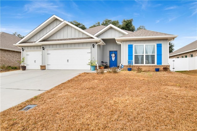 view of front of property featuring a garage and a front lawn