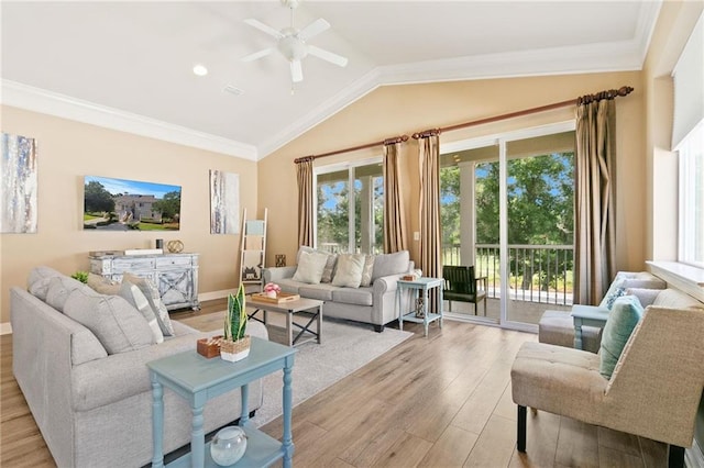 living area with light wood-style floors, lofted ceiling, crown molding, and ceiling fan