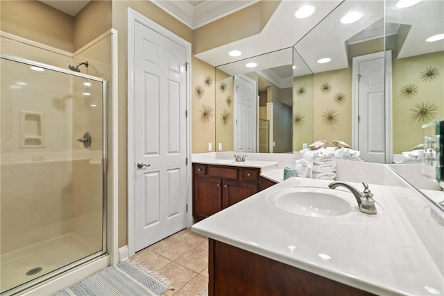 bathroom featuring tile patterned flooring, crown molding, vanity, a stall shower, and wallpapered walls