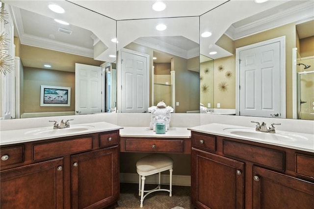 bathroom featuring a shower stall, crown molding, two vanities, and a sink