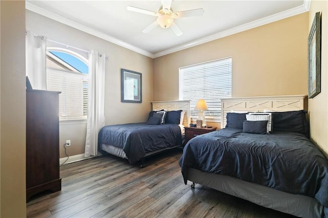 bedroom with ceiling fan, baseboards, crown molding, and wood finished floors