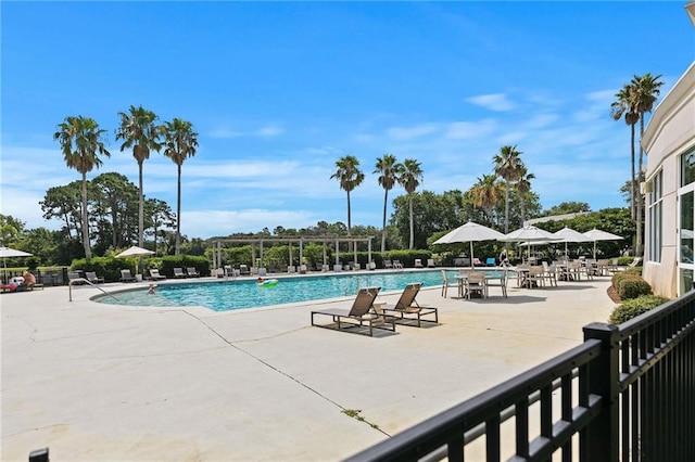 pool featuring a pergola and a patio