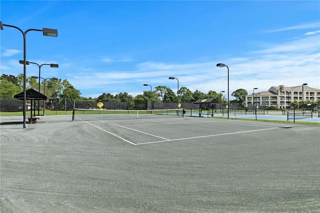 view of sport court with fence