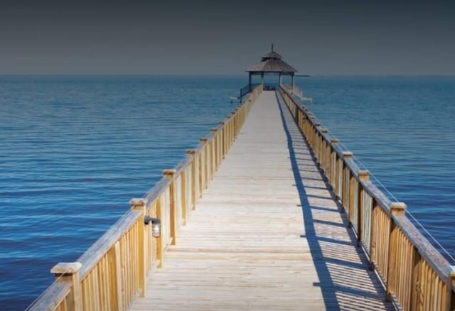 dock area featuring a pier, a water view, and a gazebo