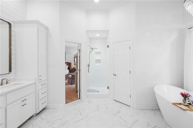 bathroom with tile walls, vanity, and plus walk in shower