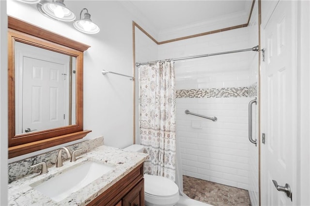 bathroom featuring crown molding, toilet, walk in shower, and vanity