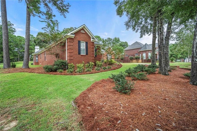 view of property exterior featuring a lawn