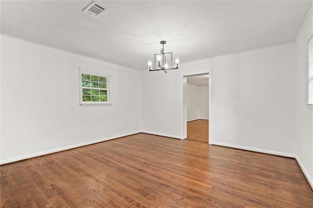 3510 Zimlich Ave, Mobile, AL 36608 - spare room with a chandelier, wood finished floors, and ornamental molding