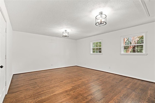 3510 Zimlich Ave, Mobile, AL 36608 - unfurnished room with wood finished floors, a textured ceiling, and attic access