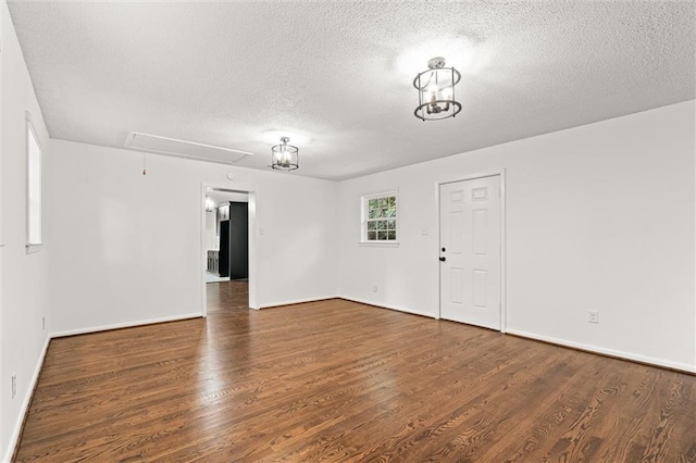 3510 Zimlich Ave, Mobile, AL 36608 - empty room with attic access, a textured ceiling, and wood finished floors