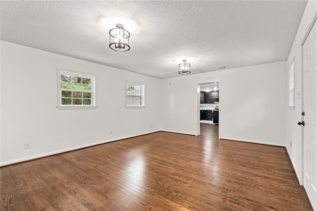 3510 Zimlich Ave, Mobile, AL 36608 - unfurnished room with a textured ceiling and wood finished floors