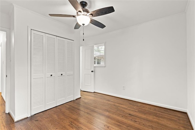 3510 Zimlich Ave, Mobile, AL 36608 - unfurnished bedroom featuring a closet, wood finished floors, crown molding, and a ceiling fan