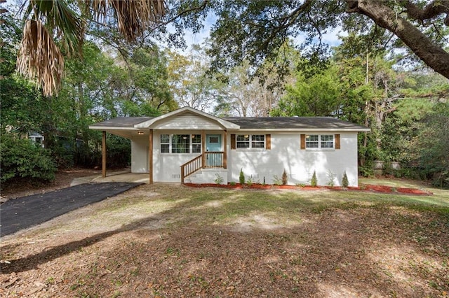 3510 Zimlich Ave, Mobile, AL 36608 - ranch-style house featuring asphalt driveway, a carport, and stucco siding