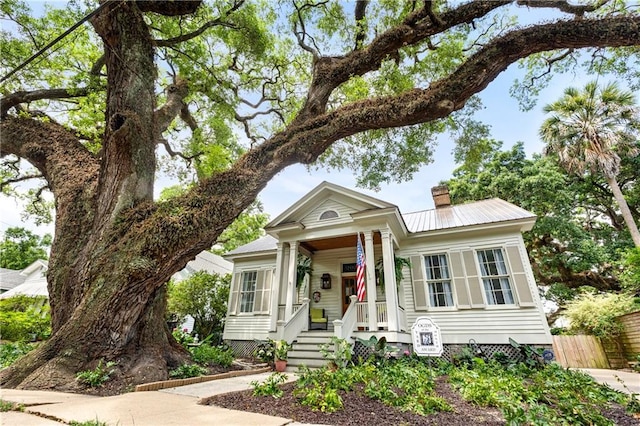 205 George St, Mobile, AL 36604 - view of front of property with a chimney, covered porch, and metal roof