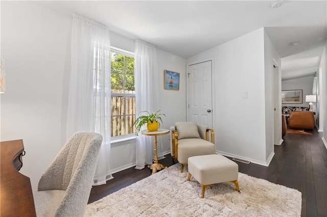 205 George St, Mobile, AL 36604 - living area featuring dark wood finished floors and baseboards