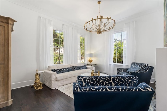 205 George St, Mobile, AL 36604 - living room featuring a chandelier, wood-type flooring, baseboards, and crown molding