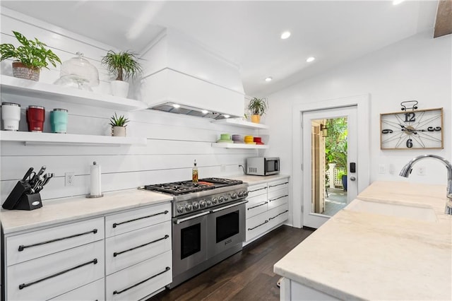 205 George St, Mobile, AL 36604 - kitchen featuring appliances with stainless steel finishes, open shelves, dark wood-style flooring, a sink, and custom range hood