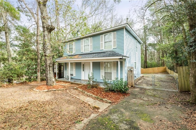 view of property featuring a porch