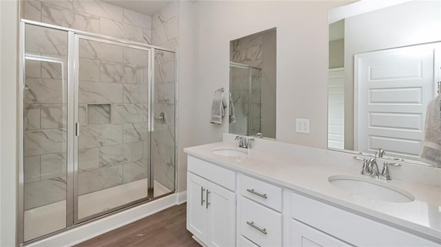 10694 Relic Rd N, Mobile, AL 36608 - full bathroom with a shower stall, double vanity, and wood finished floors