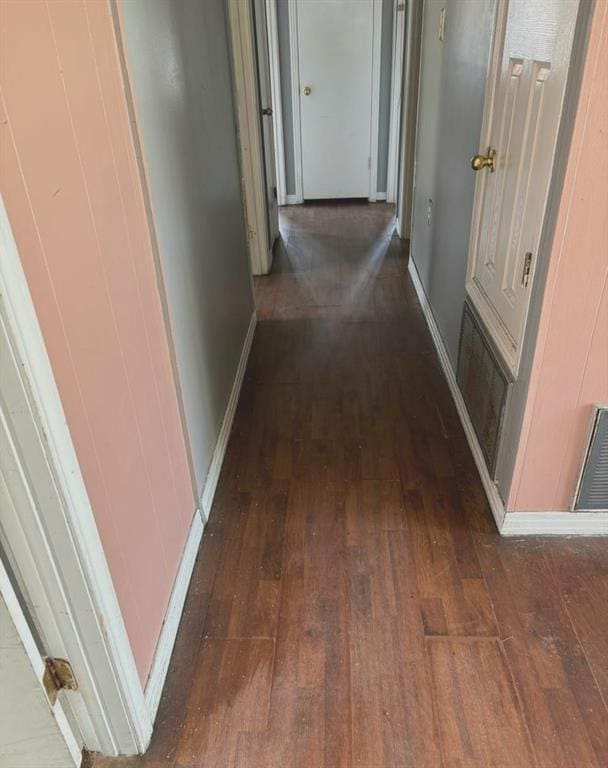 hallway featuring dark wood-type flooring