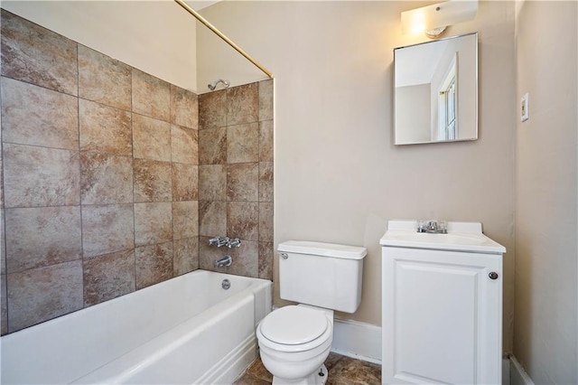 full bathroom featuring toilet, vanity, and tiled shower / bath