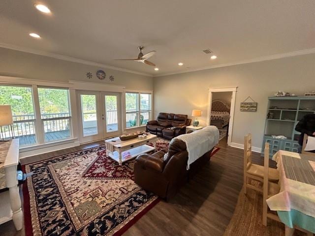 living room featuring dark hardwood / wood-style flooring, ceiling fan, ornamental molding, and french doors